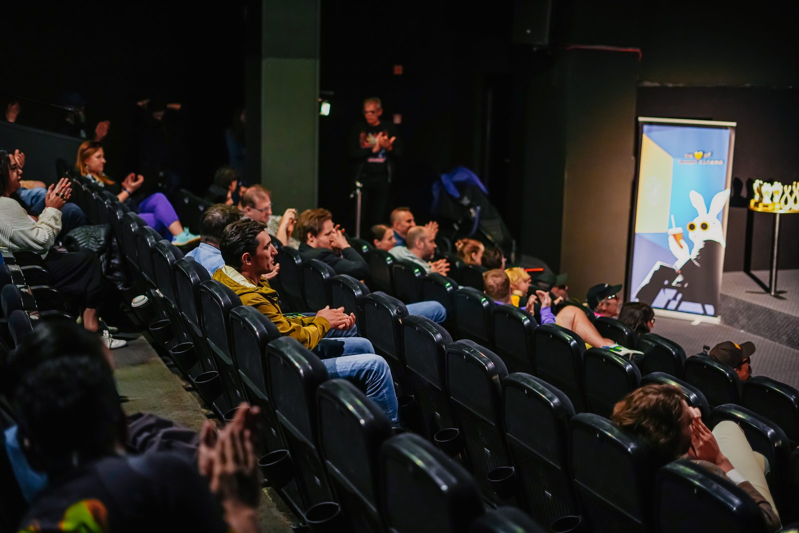 Bitcoin FilmFest audience applauding inside the cinema