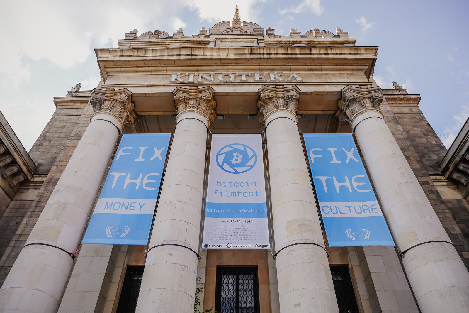 Kinoteka façade in Warsaw with BFF banners — Fix the Money, Fix the Culture